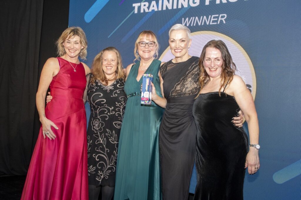 Business Solutions colleagues with their award Business Solutions colleagues with their award