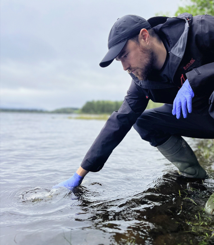 Nathan Griffiths collecting water samples