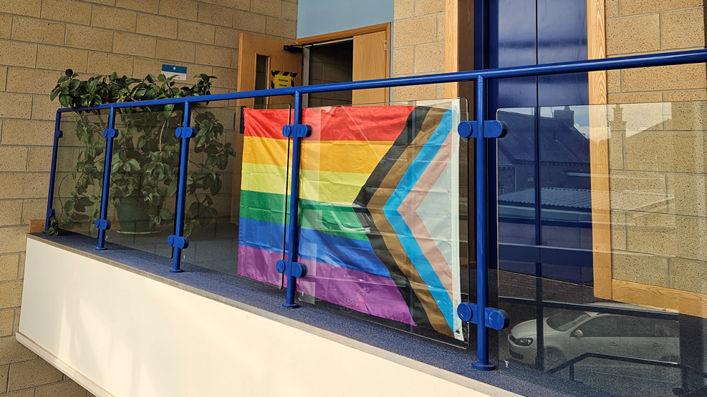 Photograph of a progress pride flag being displayed at UHI Moray's Linkwood Technology Centre campus