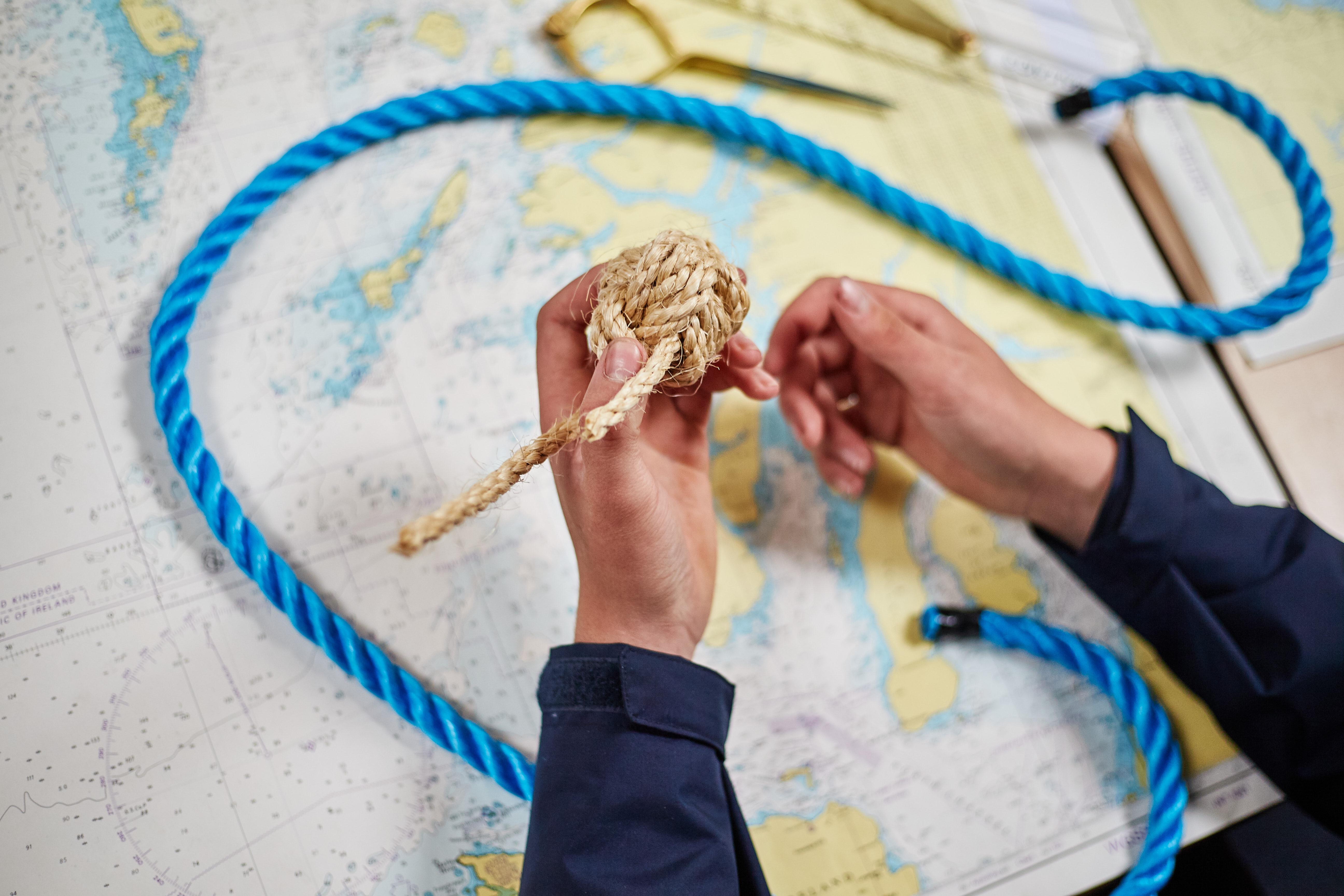 Maritime student learning knots