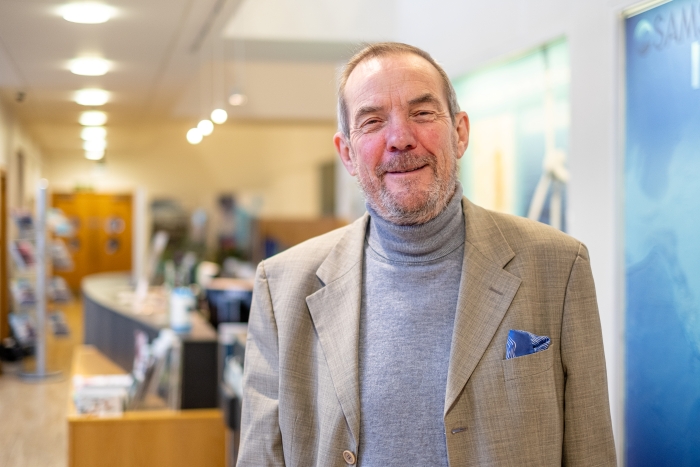 Man standing in a corridor Man standing in a corridor