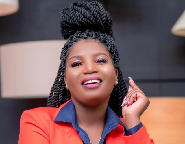 Winnie Mwongela in bright orange jacket Winnie Mwongela in bright orange jacket