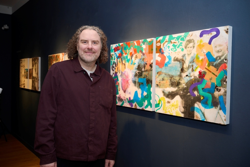 Donald Ellis Ross standing in front of artwork