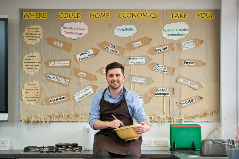 Kyle MacLennan mixing ingredients in a kitchen classroom. Kyle MacLennan mixing ingredients in a kitchen classroom.