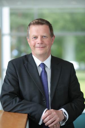 Man wearing a suit and tie looking at the camera Man wearing a suit and tie looking at the camera