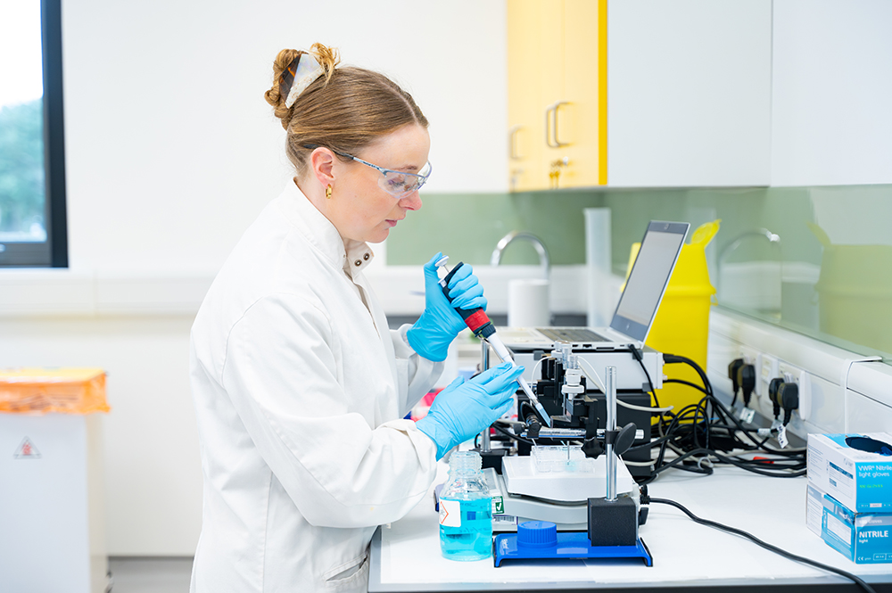Scientist using lab equipment Scientist using lab equipment