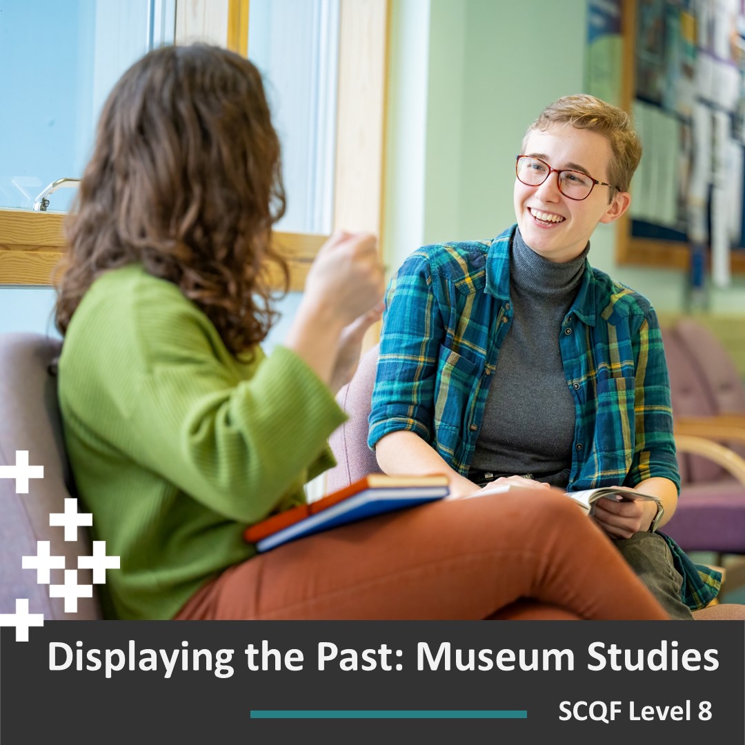 A photograph of students discussing their course