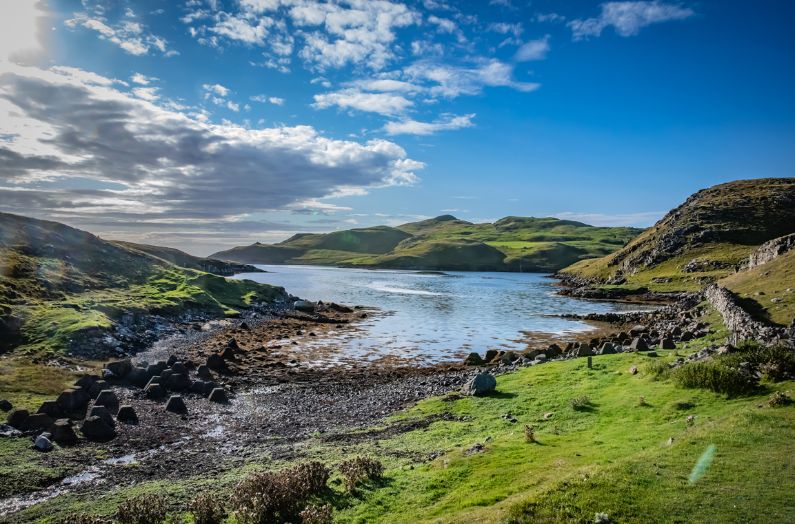 Green hills and a bay on the Shetland islands