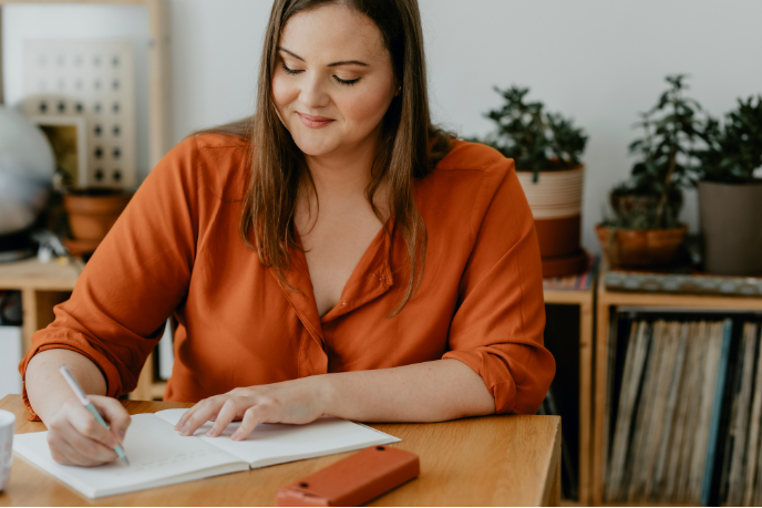 Person writing in a notebook