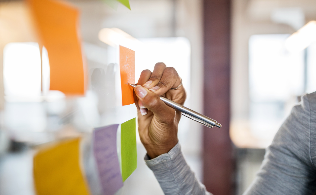 Person writing on a whiteboard